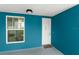 This hallway entrance has a welcome mat and a window at 1 Riverwalk Dr # 303, New Smyrna Beach, FL 32169