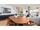 Open concept living room featuring modern decor and a dining table with seating at 10154 Hadley St, Orlando, FL 32829