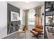 Office with modern glass desk, leather chair, and decorative shelving at 10154 Hadley St, Orlando, FL 32829