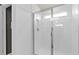 Modern shower with white subway tile, glass door and window at 10154 Hadley St, Orlando, FL 32829