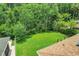 The aerial backyard view shows lush green grass and mature trees, offering quiet privacy at 10252 Kristen Park Dr, Orlando, FL 32832