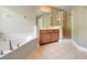Bright bathroom with a separate shower, soaking tub, and a double sink vanity with lots of counter space at 10252 Kristen Park Dr, Orlando, FL 32832