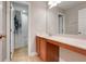 Clean bathroom featuring a long vanity and mirror, with a shower and toilet in a separate room at 10252 Kristen Park Dr, Orlando, FL 32832