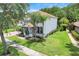 Elegant two-story home with lush landscaping and a cozy front porch, perfect for relaxation at 10252 Kristen Park Dr, Orlando, FL 32832