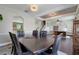 Open-concept living area connects the dining room, staircase, and office, creating a cohesive living space at 10252 Kristen Park Dr, Orlando, FL 32832