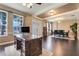 A grand living room boasting dark wood floors and decorative ceiling with recessed lighting at 10252 Kristen Park Dr, Orlando, FL 32832