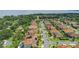 Aerial view showcasing the neighborhood layout, landscaping, rooftops and proximity to the lake at 108 Stanton Estates Cir, Winter Garden, FL 34787