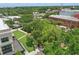 Aerial view features a park setting with lush greenery, trees, walkways and parking areas at 108 Stanton Estates Cir, Winter Garden, FL 34787