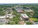 Expansive aerial view of town's architecture, landscape, and infrastructure showcasing a blend of nature and urban charm at 108 Stanton Estates Cir, Winter Garden, FL 34787