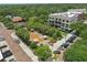 Aerial view of a town square with mature trees, manicured gardens, brick sidewalks and adjacent parking at 108 Stanton Estates Cir, Winter Garden, FL 34787