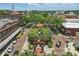 Aerial view of a town square featuring a central fountain, colorful landscaping, and inviting gathering spaces at 108 Stanton Estates Cir, Winter Garden, FL 34787