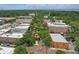 Aerial view highlights Edgewater Hotel, buildings, and trees, creating a vibrant cityscape at 108 Stanton Estates Cir, Winter Garden, FL 34787