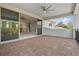 Outdoor balcony with brick flooring and sliding glass doors connecting to the living space at 108 Stanton Estates Cir, Winter Garden, FL 34787