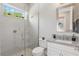 Well-lit bathroom featuring a glass-enclosed shower and a granite-topped vanity at 108 Stanton Estates Cir, Winter Garden, FL 34787