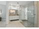 Bright bathroom featuring a double vanity, large glass shower with tiled floor, and neutral tones at 108 Stanton Estates Cir, Winter Garden, FL 34787