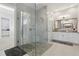 Open bathroom showcasing a glass shower enclosure, vanity with granite countertops, and neutral color palette at 108 Stanton Estates Cir, Winter Garden, FL 34787
