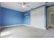 Bright bedroom featuring a ceiling fan, carpeted flooring, and a closet at 108 Stanton Estates Cir, Winter Garden, FL 34787