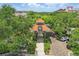 The Winter Garden clock tower park entrance with shade trees and a brick paved drive at 108 Stanton Estates Cir, Winter Garden, FL 34787