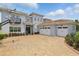Charming home with a three-car garage and brick paver driveway, creating excellent curb appeal at 108 Stanton Estates Cir, Winter Garden, FL 34787