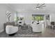 Bright living room featuring modern furniture, access to the backyard, and contemporary décor at 108 Stanton Estates Cir, Winter Garden, FL 34787