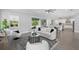 Bright living room with modern furnishings, access to outdoor space and an open-concept design at 108 Stanton Estates Cir, Winter Garden, FL 34787