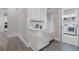Convenient mud room featuring built-in storage, a bench, and access to the laundry area at 108 Stanton Estates Cir, Winter Garden, FL 34787