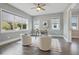 Home office is brightly lit with natural light, has modern decor and a ceiling fan at 108 Stanton Estates Cir, Winter Garden, FL 34787