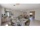 Open floor plan featuring a dining area adjacent to the kitchen and a sunlit living room at 1119 Edith Dr, Daytona Beach, FL 32117
