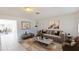 Bright living room with neutral decor and tile floors offers a modern, welcoming space at 1119 Edith Dr, Daytona Beach, FL 32117