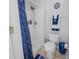 Bathroom with a walk-in shower, anchor decorations, and blue accents creating a nautical-inspired retreat at 12020 Philbrook Ct, Orlando, FL 32825