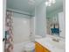 Bathroom with a single vanity, a toilet and a tub with floral shower curtain at 12020 Philbrook Ct, Orlando, FL 32825