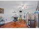 Spacious bonus room with wood flooring, ample lighting, and an opening to the exterior, perfect for entertainment or relaxation at 12020 Philbrook Ct, Orlando, FL 32825