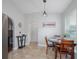 Dining area featuring neutral colors, and modern lighting, enhancing the space's functionality and charm at 12020 Philbrook Ct, Orlando, FL 32825