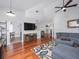 Inviting living room with hardwood floors, stylish furniture, and an open floor plan at 12020 Philbrook Ct, Orlando, FL 32825
