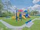 A park featuring a large playground with slides, swings, benches and climbing equipment at 12020 Philbrook Ct, Orlando, FL 32825
