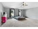 Spacious bedroom featuring neutral walls, carpet, and a ceiling fan at 125 Vervain Ave, Davenport, FL 33837