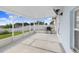 Outdoor screened patio with a grill, perfect for entertaining at 125 Vervain Ave, Davenport, FL 33837