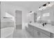 Bright, spa-like bathroom featuring a large soaking tub and double sink vanity at 13081 Sunrise Harvest Dr, Winter Garden, FL 34787