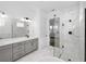 Modern bathroom featuring a glass shower and double sink vanity with granite countertops at 13081 Sunrise Harvest Dr, Winter Garden, FL 34787