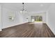 Spacious living room with plenty of natural light and sliding glass doors to backyard at 13081 Sunrise Harvest Dr, Winter Garden, FL 34787