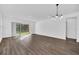 Bright and spacious living room with sliding doors leading to the backyard at 13081 Sunrise Harvest Dr, Winter Garden, FL 34787