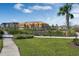 A community park features a modern playground, green spaces, sidewalks and new homes in the background at 13081 Sunrise Harvest Dr, Winter Garden, FL 34787