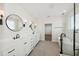 Modern bathroom with double sinks, large mirrors, and a separate shower and soaking tub at 13175 Telsen St # 40, Winter Garden, FL 34787