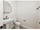 Stylish half-bathroom with modern fixtures including pedestal sink and updated fixtures, designed for convenience at 13175 Telsen St # 40, Winter Garden, FL 34787