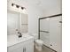 Modern bathroom featuring sleek fixtures, a glass-enclosed shower, and a contemporary vanity with ample storage space at 13175 Telsen St # 40, Winter Garden, FL 34787