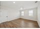 The bright bedroom features neutral hardwood flooring and two bright windows at 13175 Telsen St # 40, Winter Garden, FL 34787