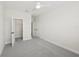 The neutral bedroom has carpeted floors, a ceiling fan, two closets and bright white trim at 13175 Telsen St # 40, Winter Garden, FL 34787