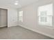 Bright, airy bedroom with ample natural light, closet, and neutral finishes, providing a comfortable retreat at 13175 Telsen St # 40, Winter Garden, FL 34787