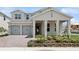 Inviting two-story home with a two-car garage and lush landscaping at 13175 Telsen St # 40, Winter Garden, FL 34787