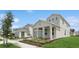 Charming two-story home showcasing an attached garage, manicured lawn, and inviting curb appeal at 13175 Telsen St # 40, Winter Garden, FL 34787